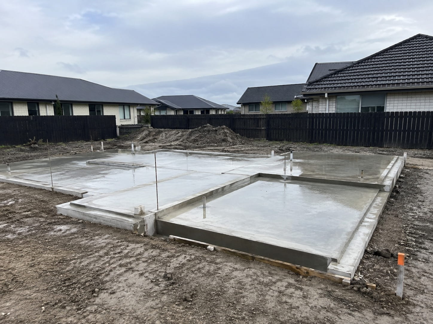 Poured concrete house foundation with thickened edge beams on a Christchurch section
